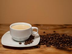 Cup of coffee and roasted coffee beans on a wooden background. royalty free stock photography Roasted Coffee Beans, Wooden Background, Stock Photography Free, Coffee Roasting, Coffee Beans, Coffee Cups, Coffee