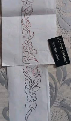 two pieces of paper with designs on them