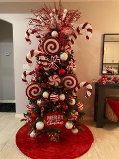 a christmas tree decorated with candy canes and ornaments