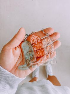 Our cowboy boot keychains, with their simple yet elegant look are the perfect western party favor. Available in 2 designs and 3 different translucent acrylic colors, there is something for everyone! Design is laser engraved into 1/8" translucent acrylic. Keychain measures approx. 2.7" x 1.7". Available in Rose, Sea Glass, and Clear. Cowboy Boots Keychain, Western Engagement Party, Cowgirl Keychain, Western Party Favors, Western Keychain, Western Things, Western Engagement, Last Rodeo, Gift Bachelorette Party