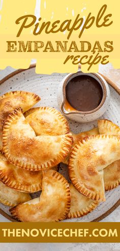 homemade empanadas on a plate with dipping sauce