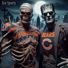 two statues of chicago bears football players in front of a full moon