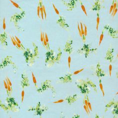 an orange and green pattern on a light blue background