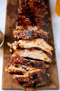 barbecue ribs with bbq sauce on a cutting board