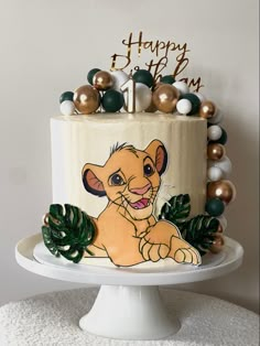 a birthday cake decorated with an image of the lion king