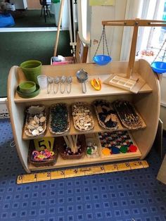 a display case filled with lots of different items on top of a blue carpeted floor