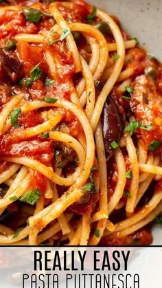 pasta with tomato sauce and parsley on top in a white bowl, text overlay reads really easy pasta pultininesco