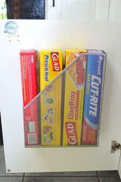 a white refrigerator freezer sitting inside of a kitchen next to a stack of books