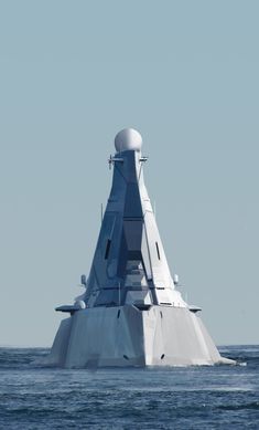 a large white boat floating on top of the ocean