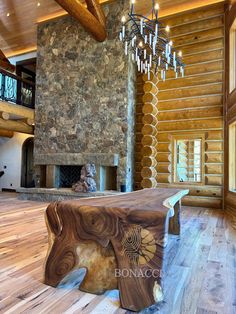 a large wooden table sitting in the middle of a living room next to a fireplace