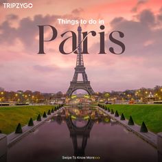 the eiffel tower in paris is reflected in water at dusk with pink clouds