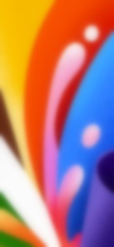 blurry image of an orange, blue, and green object