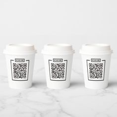 three coffee cups with qr code printed on them