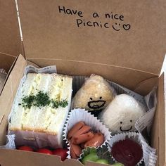 an open box filled with stuffed animals and food