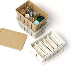 an assortment of crafting supplies in storage containers