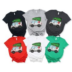 four different colored shirts with an image of a camper and christmas tree on the front