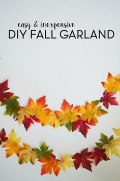 an easy and expensive diy fall garland made with fake leaf garlands that you can make in minutes