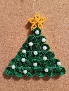 a christmas tree made out of rolled up paper