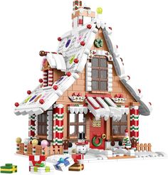 a lego christmas house is shown with candy canes