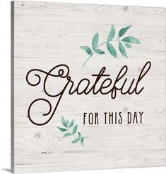 a wooden sign that says grateful for this day