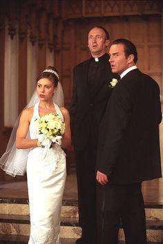 a bride and groom standing in front of the alter at their wedding ceremony on steps