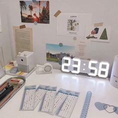 an alarm clock sitting on top of a white desk