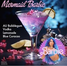 a purple cocktail with lemon wedges in it and the caption mermaid barbie vodka