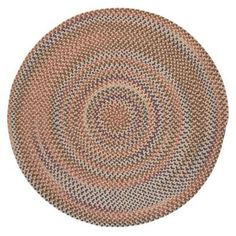 a round rug with an oval design on the center and bottom, in various colors