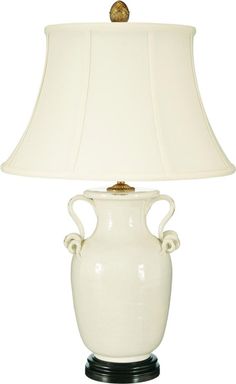 a white vase lamp with a black base and gold trimmings on the bottom