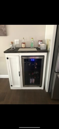 Modern mini fridge cabinet with smaller door hinge door. This listing is for a size to be MAX SIZE for this piece only to be  36"x22.5"(20"internal depth)"x41" this unit allows the mini fridge hidden and off the floor with an open back (for venting) if the depth is bigger than 20" we will add a extension on the bottom of mini fridge side to extend depth) a side floating shelf which is coved by bead board (runs from side to side cabinet covered by a barn door slider with black hardware only! (A f Mini Fridge Glass Door, Small Wine Fridge Cabinet, Mini Fridge In Dining Room, Home Office Mini Fridge, Coffee Station With Mini Fridge, Mini Fridge Stand Diy, Hidden Mini Fridge In Bedroom, Modern Mini Bar Designs For Home, Cabinet For Mini Fridge