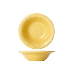 an empty yellow bowl and plate on a white background