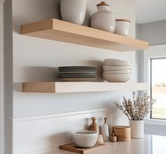 some shelves with bowls and plates on them