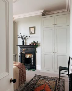 a living room with a fireplace and white walls