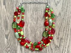 Christmas Necklace Red Green and BLING Holiday Jewelry | Etsy Red Christmas Party Necklaces, Christmas Holiday Necklace With Round Beads, Festive Red Beaded Necklace With Colorful Beads, Handmade Green Holiday Necklaces, Handmade Red Necklace For Christmas, Handmade Green Necklace For Holiday, Handmade Green Necklace For Holidays, Christmas Necklace With Colorful Round Beads, Christmas Necklaces With Colorful Round Beads