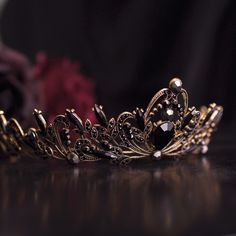 a gold tiara sitting on top of a table