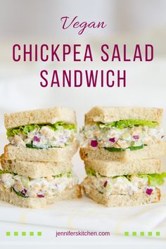 the chicken salad sandwich is stacked on top of each other