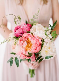 a woman holding a bouquet of flowers on her wedding day, with the caption instagram