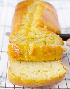 a loaf of bread sitting on top of a cooling rack