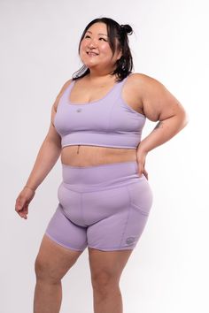 Introducing the dreamy Ethereal Collection, designed for empowered women who are a work in progress! This size inclusive lavender longline bra features a flattering cross strap back, reflective logos, removable pads, and buttery soft lining. Low to medium impact, this comfortable sports bra is great for light to regular workouts, yoga sessions, and everyday wear. Make it an ethereal dream and pair it with our Ethereal Women's Highwaisted Compression Shorts for the perfect blend of style, comfort Workouts Yoga, Chevron Top, Pose References, Man Icon, Amazing Fashion, Longline Bra, A Work In Progress, Compression Shorts, Iconic Women