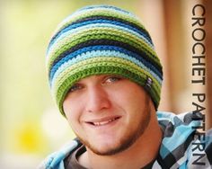 a young man wearing a striped hat and looking at the camera with a smile on his face