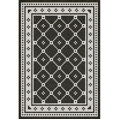 a black and white rug with an intricate design on the bottom, in square format