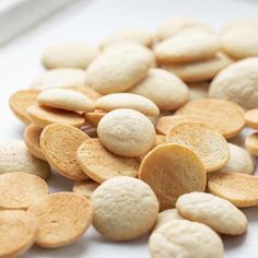 a pile of white crackers sitting on top of a table