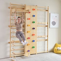 a woman is climbing on a wooden ladder