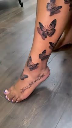 a woman's foot with butterflies on it and the words mother written in black ink