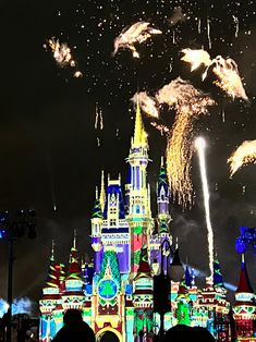 fireworks in the sky over a castle at night