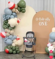 there is a baby stroller and balloons in front of a sign that says o - fish ally one