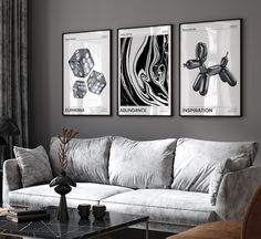 a living room filled with furniture and paintings on the wall above it's coffee table