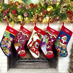 christmas stockings hanging from a mantel over a fireplace