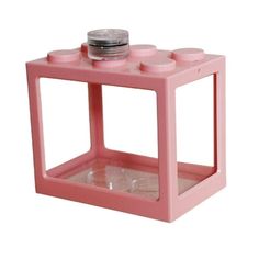 a pink plastic box with two cups on top