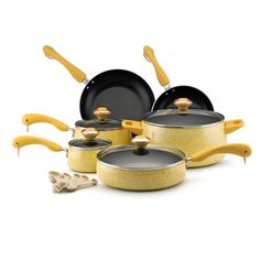 an assortment of pots and pans with wooden handles on a white background, including one large frying pan